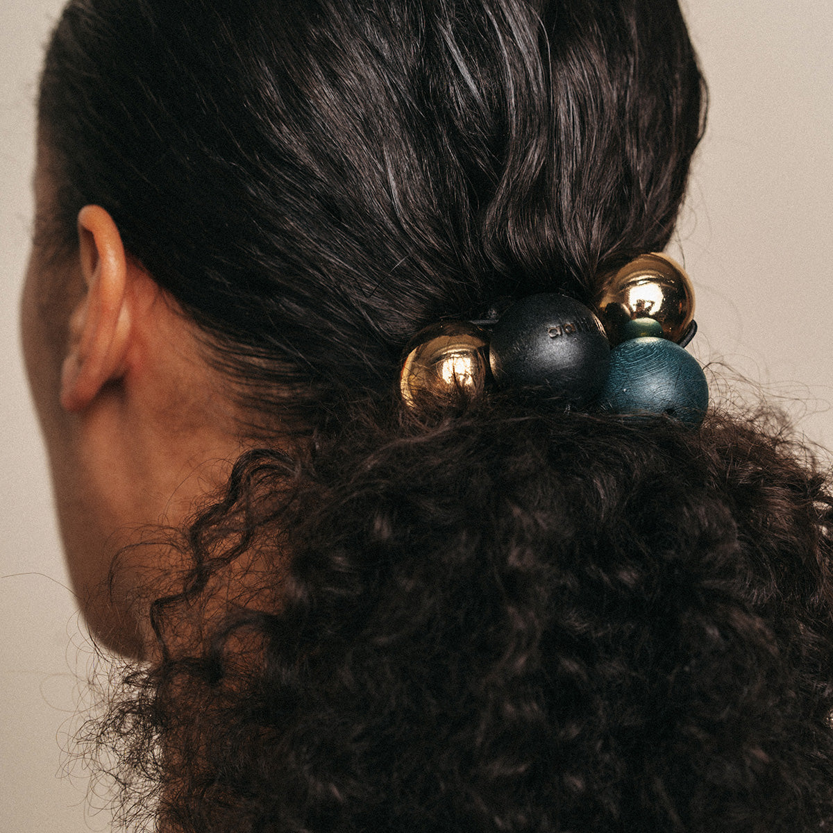 Pom pom hair band, black and gold